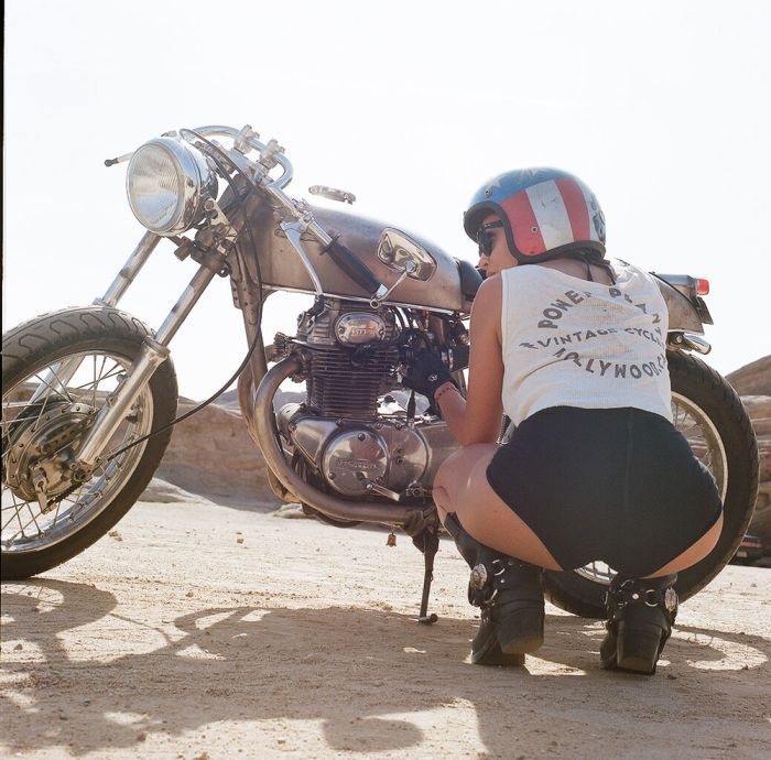 A playful frame from Girls on a motorcycle — online in Guangzhou